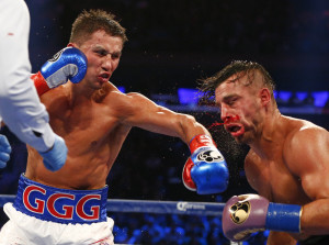 Gennady Golovkin, left, hits David Lemieux in the eighth round of a world middleweight title fight at Madison Square Garden in New York on Saturday, Oct. 17, 2015. Golovkin won by a TKO in the eighth round. (AP Photo/Rich Schultz) ORG XMIT: NYRS111
